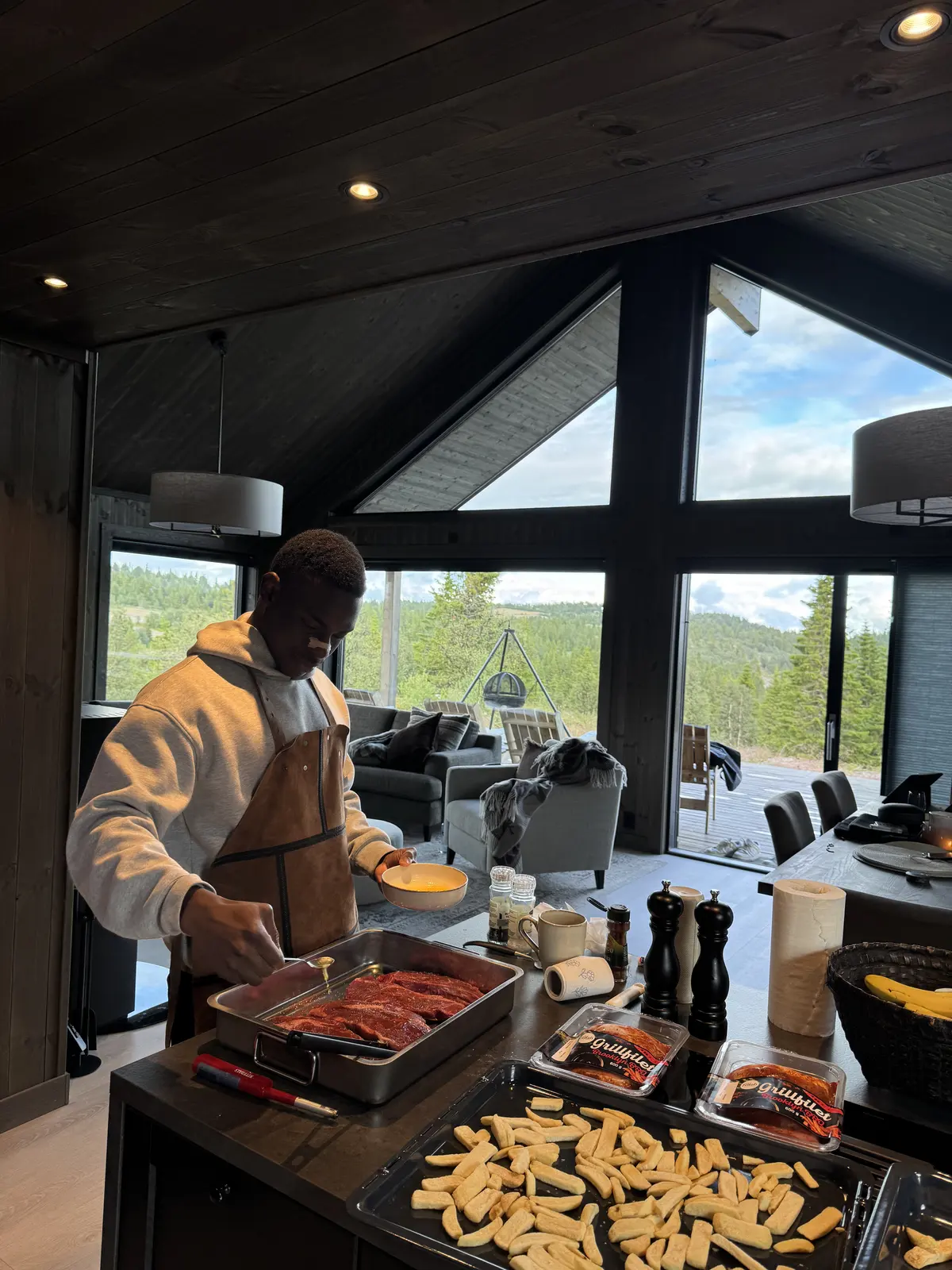 Fathin preparing food in a cabin kitchen