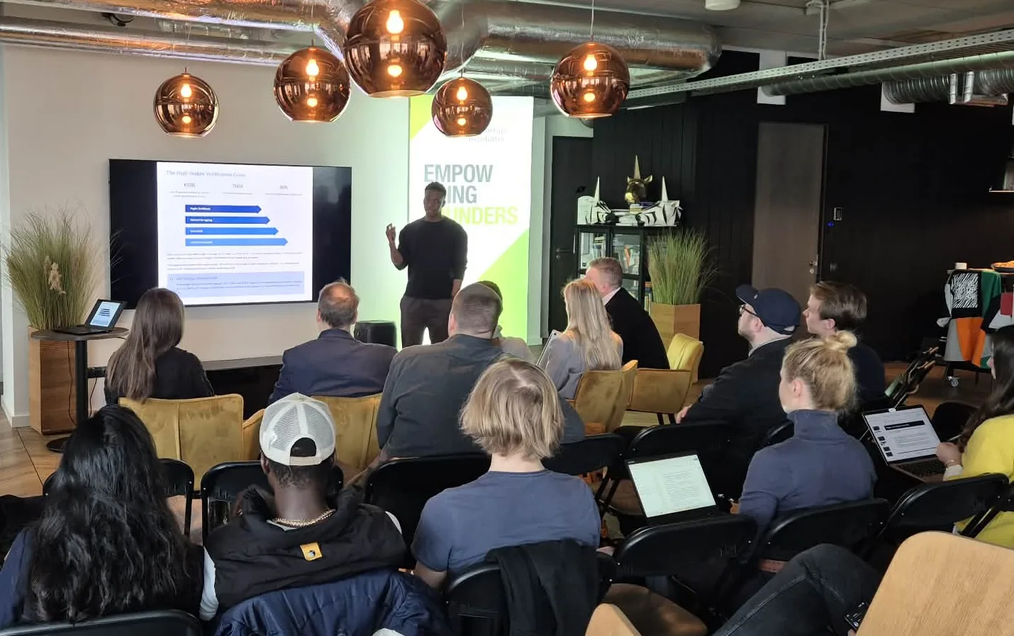 Fathin presenting to an audience at an Empowering Founders event