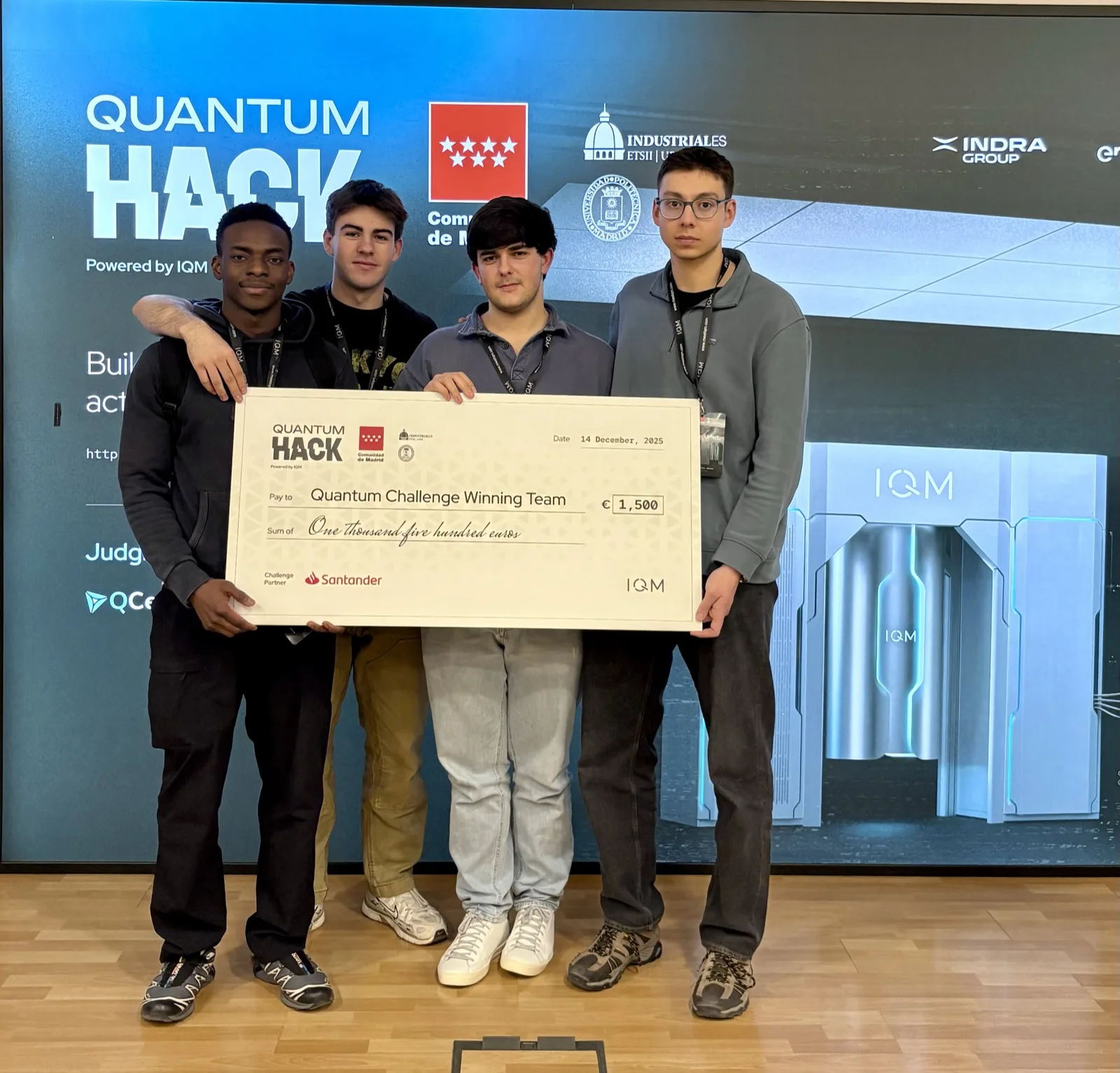 Fathin and teammates holding a Quantum Challenge winning team prize